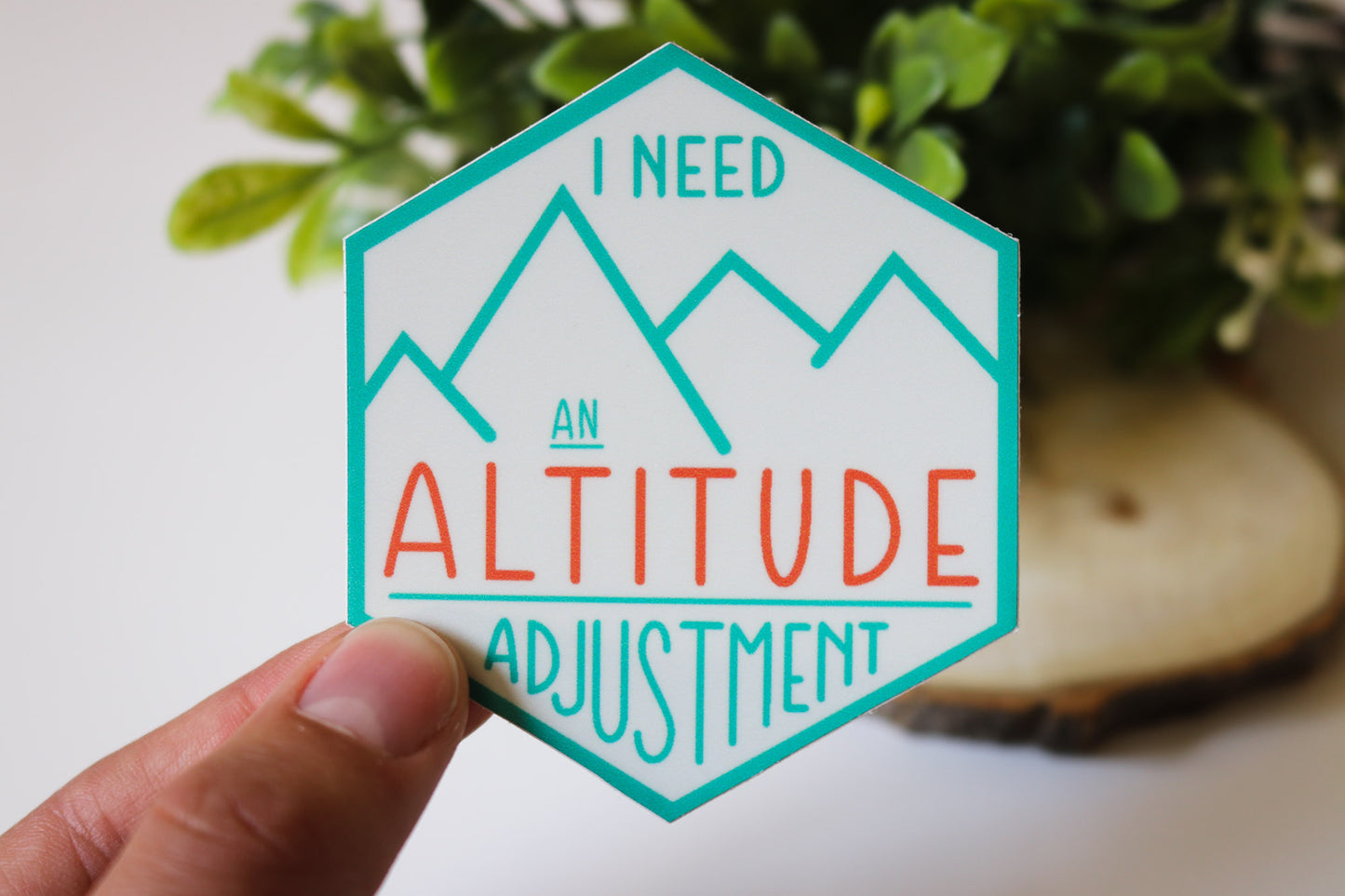 Cream colored sticker with blue outline and graphics
